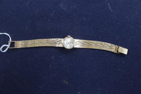 A ladys 9ct gold Rolex Precision manual wind wrist watch, on a fancy 9ct Rolex bracelet.